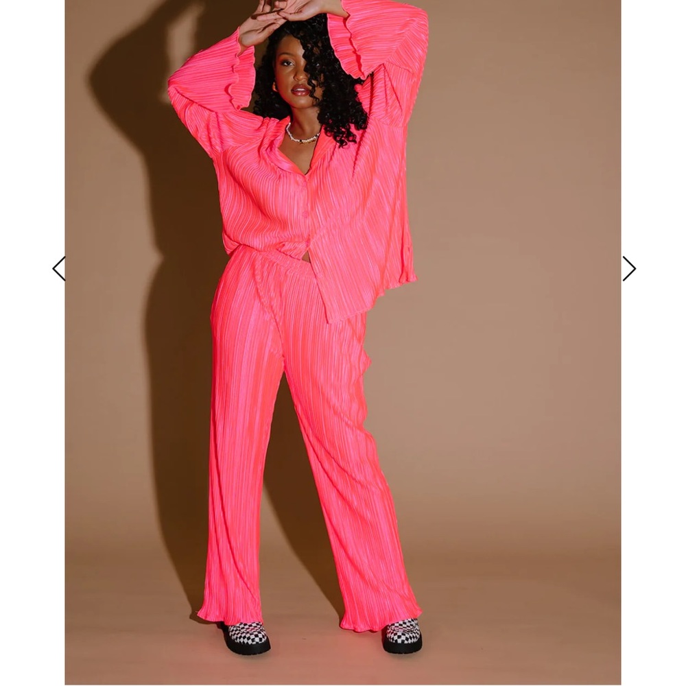 Dressed in Lala Plissé set in electric pink